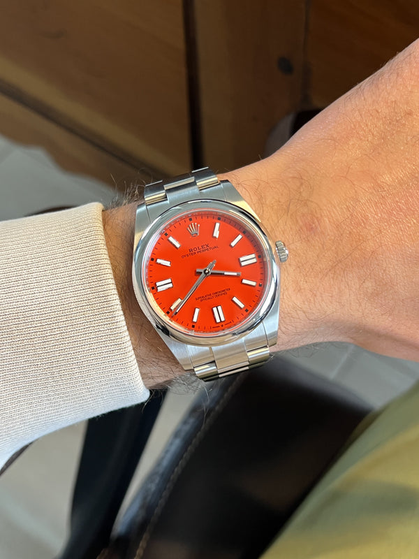 The Rolex Oyster Perpetual Green, Blue, and Red 124300