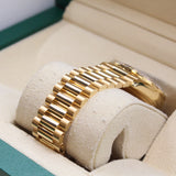 Rolex - Unworn Yellow Gold Day-Date 36 Green Baguette Dial Diamond Bezel 128348RBR
