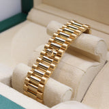 Rolex - Unworn Yellow Gold Day-Date 36 Green Baguette Dial Diamond Bezel 128348RBR