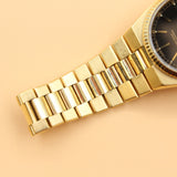Rolex - Pre-owned Yellow Gold Day-Date Oysterquartz Black Dial 19018