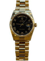Rolex - Pre-owned Yellow Gold Day-Date 36 Single Quick Black Pyramid Dial Arabic Day and Date Wheel 18038
