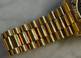 Rolex - Pre-owned Yellow Gold Day-Date 36 Single Quick Black Pyramid Dial Arabic Day and Date Wheel 18038