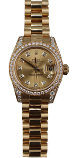 Rolex - Pre-owned Yellow Gold Lady-Datejust 26mm Champagne Dial Diamond Bezel 179158