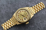 Rolex - Pre-owned 26mm Yellow Gold Lady Datejust 26 Champagne Ruby and Diamond Dial 69178