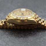 Rolex - Pre-owned 26mm Yellow Gold Lady Datejust 26 Champagne Ruby and Diamond Dial 69178