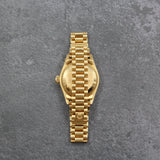 Rolex - Pre-owned 26mm Yellow Gold Lady Datejust 26 Champagne Ruby and Diamond Dial 69178