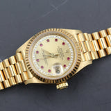 Rolex - Pre-owned 26mm Yellow Gold Lady Datejust 26 Champagne Ruby and Diamond Dial 69178