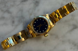 Rolex - Pre-owned Yellow Gold Oyster Perpetual 26 Blue Diamond Dial 67198