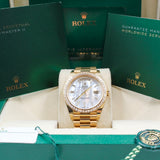 Rolex - Unworn Yellow Gold Day Date 40 Mother of Pearl Diamond Baguette Dial 228398TBR