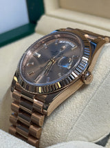 Rolex - Pre-owned Rose Gold Day-Date 40 Presidential Sundust Baguette Dial 228235