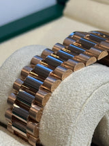 Rolex - Pre-owned Rose Gold Day-Date 40 Presidential Sundust Baguette Dial 228235