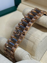 Rolex - Pre-owned Rose Gold Day-Date 40 Presidential Sundust Baguette Dial 228235