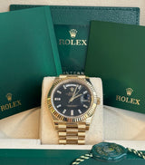 Rolex - Pre-owned Yellow Gold Day-Date 40 Presidential Black Baguette Dial 228238