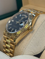 Rolex - Pre-owned Yellow Gold Day-Date 40 Presidential Black Baguette Dial 228238