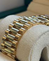 Rolex - Pre-owned Yellow Gold Day-Date 40 Presidential Black Baguette Dial 228238