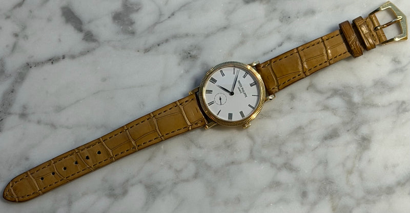 Patek Philippe - Pre-owned Yellow Gold Calatrava White Dial 7119J