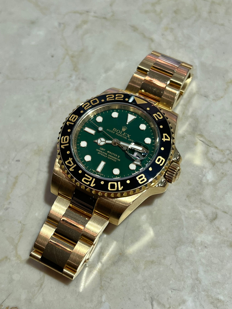 Rolex - Pre-owned Yellow Gold GMT Master II Green Dial 116718LN